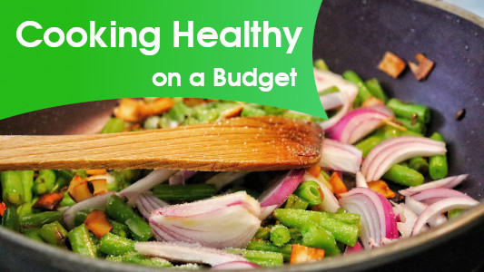 laptop and mobile phone showing The Simple Guide to Eating Healthy on a Budget