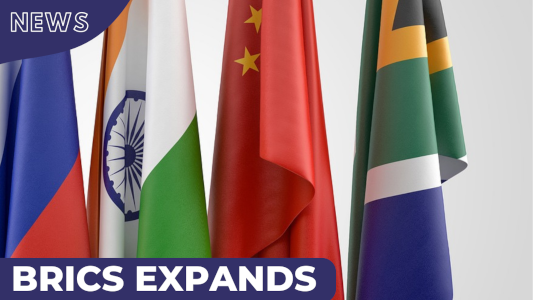 laptop and mobile phone showing BRICS Expands to Include 6 New Members
